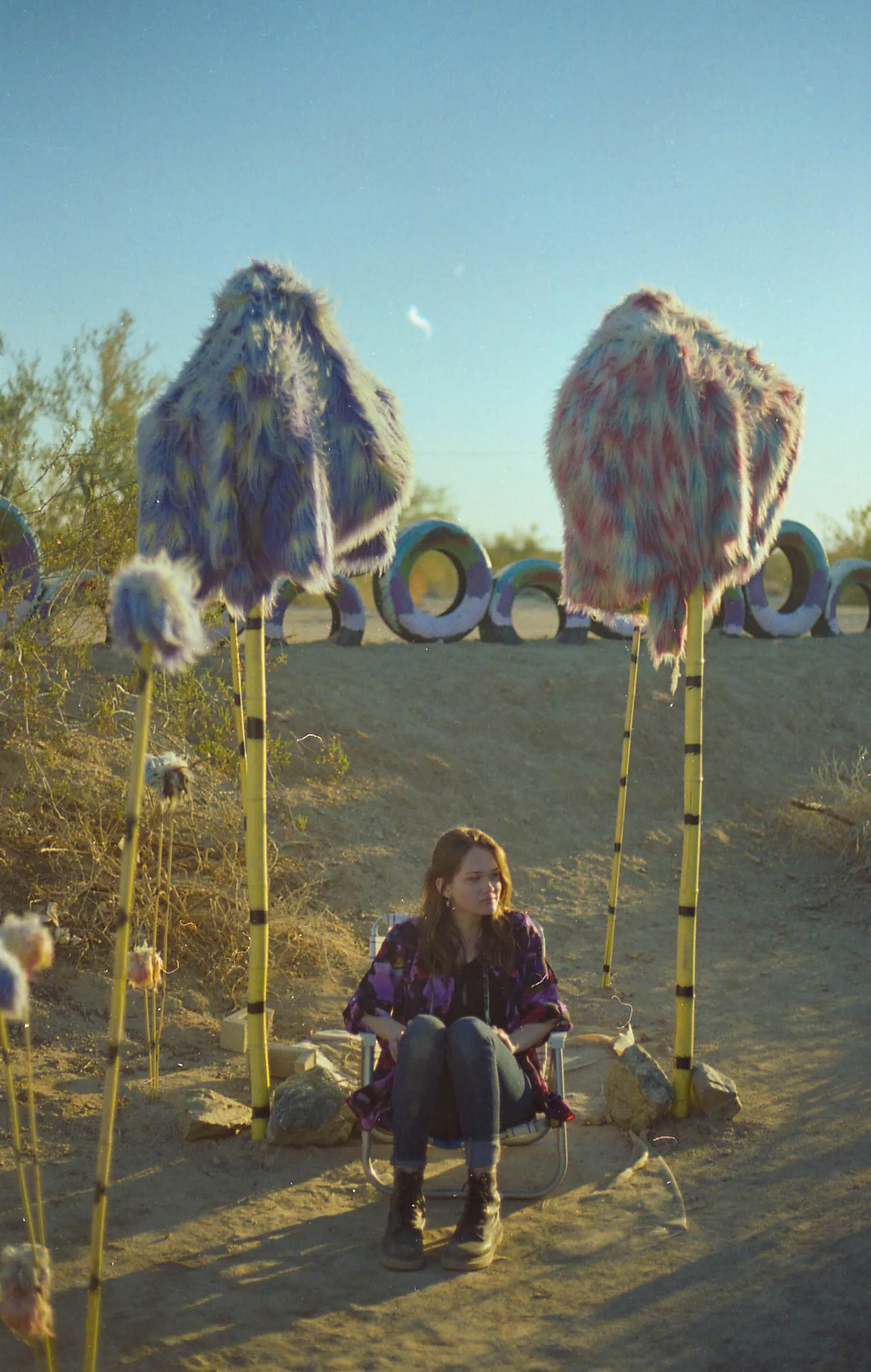A seated portrait inside the desert installation.